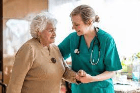 Female nurse and an old female patient - Adult Nursing