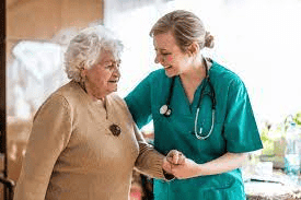 Female nurse and an old female patient - Adult Nursing